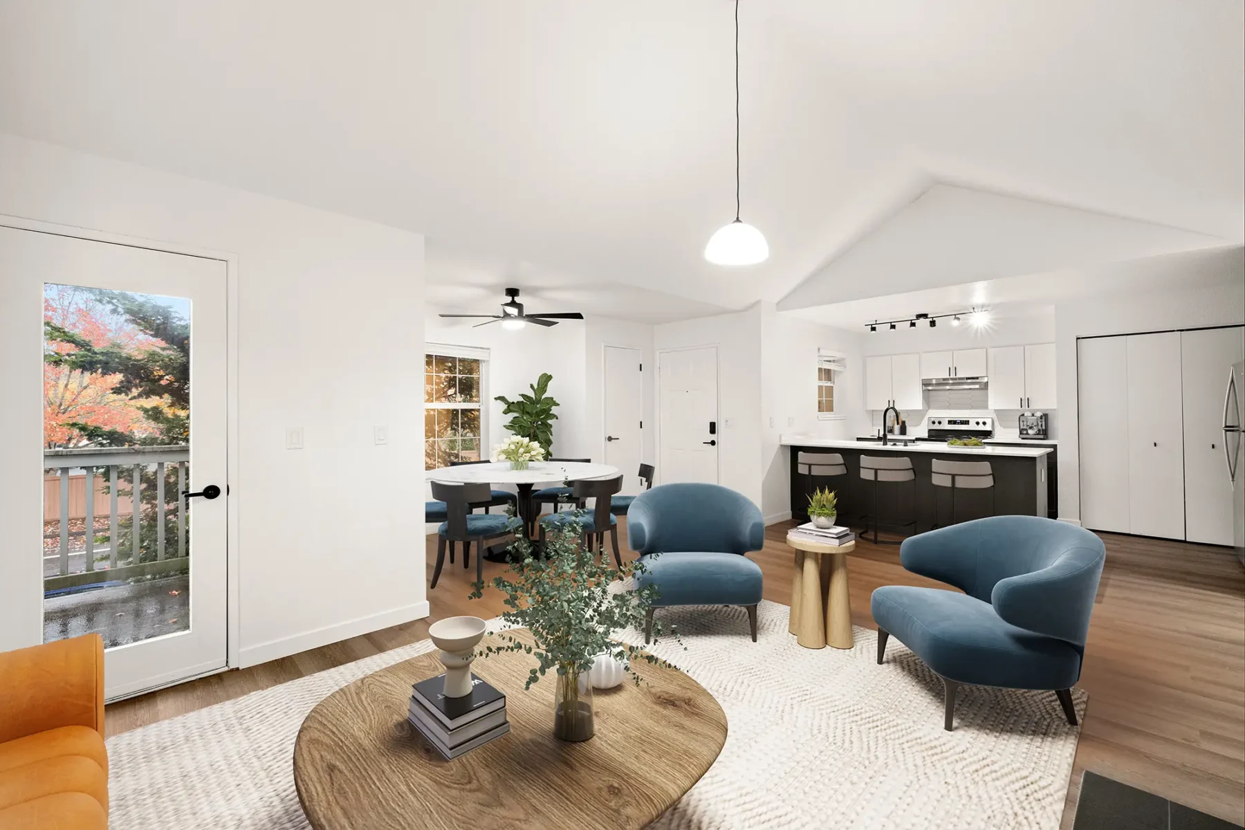 Furnished living area and dining area with view of kitchen at Larkspur Place Vancouver apartments